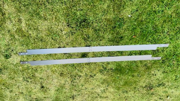 Rite-Edge Cor-Ten steel edging with a natural rusted finish, used to create clean landscape borders in a garden